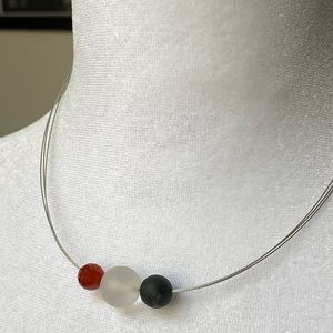 Beads on wire necklace.  Adjustable perfect condition
